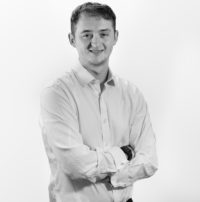 grey filtered headshot of James Andrews